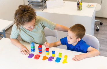 teacher woman learn  preschooler boy to count