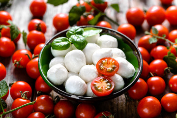 Cherry tomato, mozzarella and basil for Italian caprese salad, mediterranean food concept