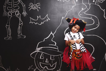 Cute girl in pirate costume in halloween