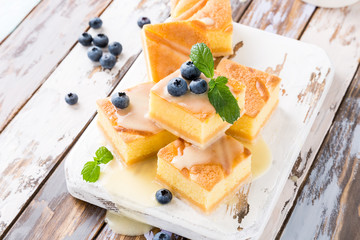 Healthy dessert. Homemade pudding cake with custard cream and blueberries. Sweet gluten free food. Copy space.