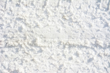 Road in winter, texture of snow and track of tyres