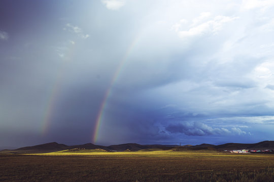 rainbow over grassland © Zhong
