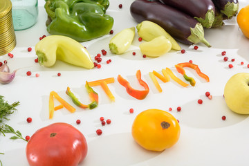 The word is Autumn from pieces of pepper. Multicolored fresh vegetables - a symbol of autumn