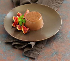 Delicious home-made chocolate dessert Panna cotta. Cream-caramel, caramel custard, with figs.