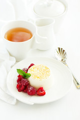 Delicious home-made dessert Panna cotta. Cream-caramel, caramel custard, with raspberries.