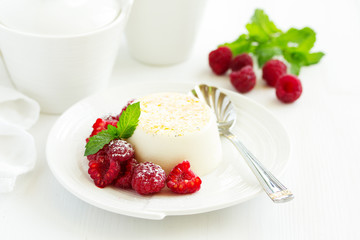 Delicious home-made dessert Panna cotta. Cream-caramel, caramel custard, with raspberries.