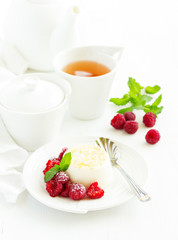 Delicious home-made dessert Panna cotta. Cream-caramel, caramel custard, with raspberries.