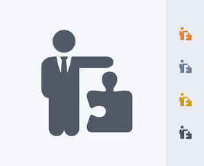 Businessman Holding Puzzle Piece - Carbon Icons. A professional, pixel-aligned icon designed on a 32x32 pixel grid and redesigned on a 16x16 pixel grid for very small sizes.