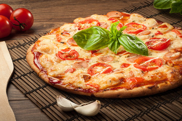 Delicious fresh pizza served on wooden table