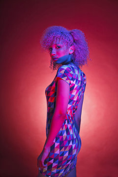 portrait of a gorgeous black woman with vintage clothes and retro neon lights