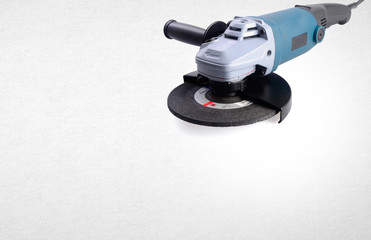 Electric grinder mechanic or angle grinder on background.