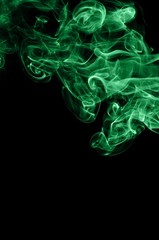 Fototapeta premium Abstract green smoke on black background, smoke background,green ink background,green, beautiful color smoke