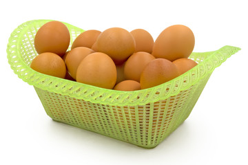 Eggs in basket isolated on white background