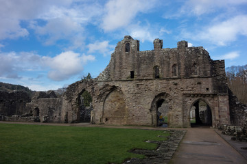 Fototapeta na wymiar Chepstow castle courtyard against puffy clouds