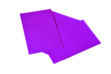 Purple colored note papers shot on white background.