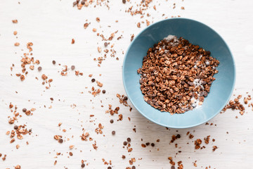 Healthy cereal breakfast. Sweet granola on messy background. Wholegrain vegetarian morning tasty food.