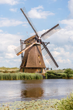 Landscape view on the old windmill in Kinderdijk village in Netherlands