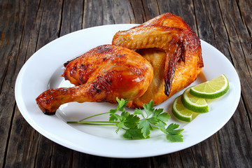 half of appetizing grilled chicken on plate © myviewpoint