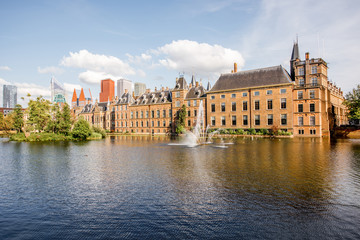 Naklejka premium Cityscape view on the small lake with beautiful old buildings and modern skyscrapers on the background in the centre of Haag city, Netherland