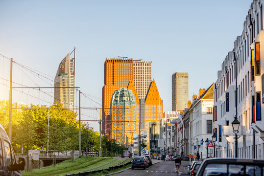 Street view on the modern office district with skyscrapers during the sunset in Haag city, Netherlands
