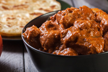 Chicken tikka masala served with bread naan