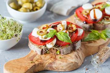 sandwiches with mozzarella, tomatoes and olives