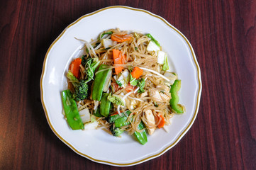 Veggie Noodle, Stir-fried thin rice noodles, bean sprouts, broccoli, carrots, baby corn, peapods, napa and sweet basil leaves.