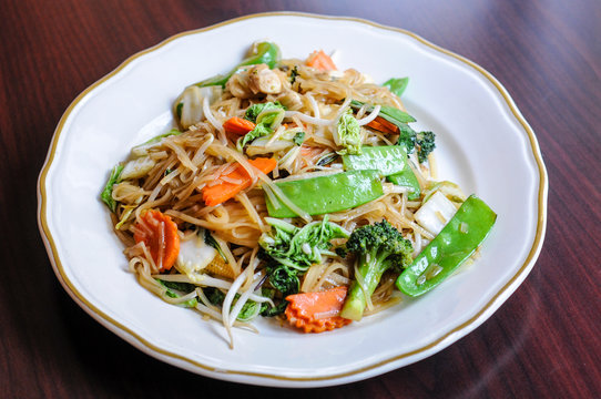 Veggie Noodle, Stir-fried thin rice noodles, bean sprouts, broccoli, carrots, baby corn, peapods, napa and sweet basil leaves.