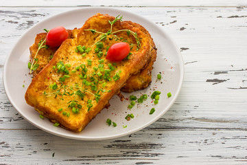 toasted slices of bread baguette with vegetables 