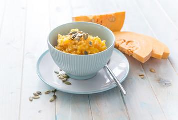 Pumpkin porridge and pieces of pumpkin 