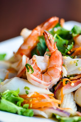 Seafood Salad, Mixed seafood, onion, carrot and cilantro in a spicy lime sauce.