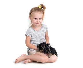 puppy york and little girl 