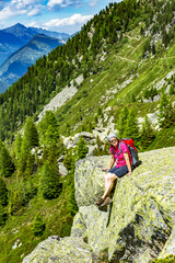 Naklejka na ściany i meble Woman hiking in the Alps