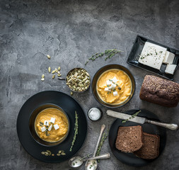 pumpkin soup in black plates 