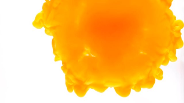 Concept of ink jet orange color paint dispersing in water abstract background