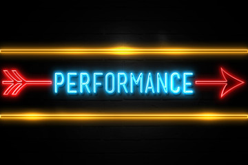 Performance  - fluorescent Neon Sign on brickwall Front view