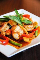 Stir-Fried Spicy Seafood, Stir-fried red curry with shrimp, mussels, scallops, squids, crabmeat, fish balls, bamboo shoots, green beans, basil leaves and eggplant
