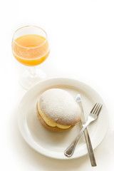 Creamy bun and glass of juice