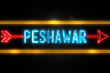 Peshawar  - fluorescent Neon Sign on brickwall Front view