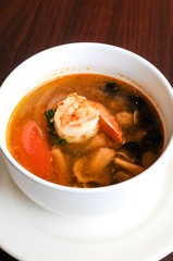 Shrimp Tom Yum, Mushroom, tomatoes, lemongrass, lime leave, galangal in Thai chili sour broth.