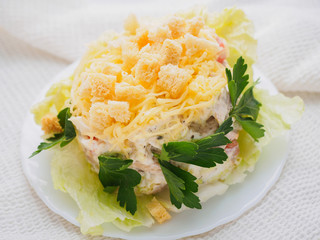 cesar salad with greens on a white plate
