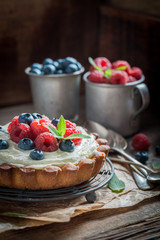 Homemade and rustic tart with berries and mascarpone
