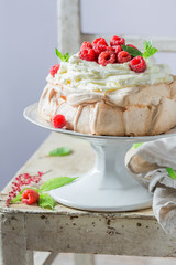 Sweet and creamy Pavlova dessert made of mascarpone and berries