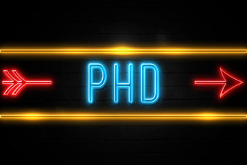 Obraz premium Phd - fluorescent Neon Sign on brickwall Front view