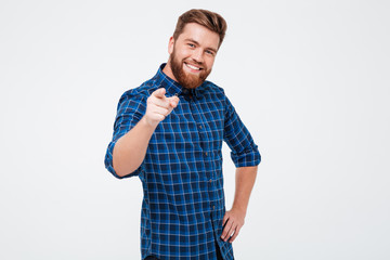 Cheerful bearded man pointing at camera isolated