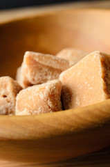 Fudge Pieces in Light Wood Bowl Close Up