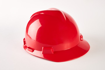 Fototapeta premium Red hard hat isolated on white