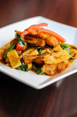 Stir-Fried Spicy Catfish, Stir-fried catfish with curry paste, bamboo shoots, eggplants, bell peppers, basil and green beans.