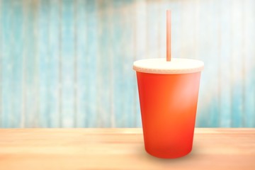 Composite image of red cup over white background