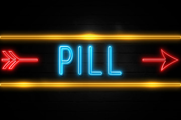Obraz premium Pill - fluorescent Neon Sign on brickwall Front view